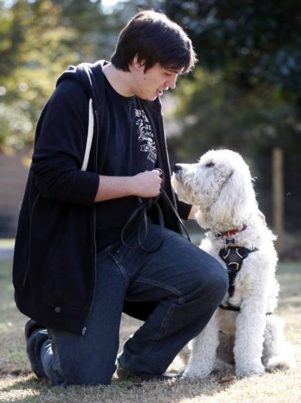 Zakk Wrabiutza training a service dog during the early years of Camp Miracle Paws
